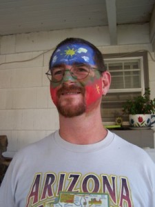 Picture of Jason with face painted red, white, and blue.